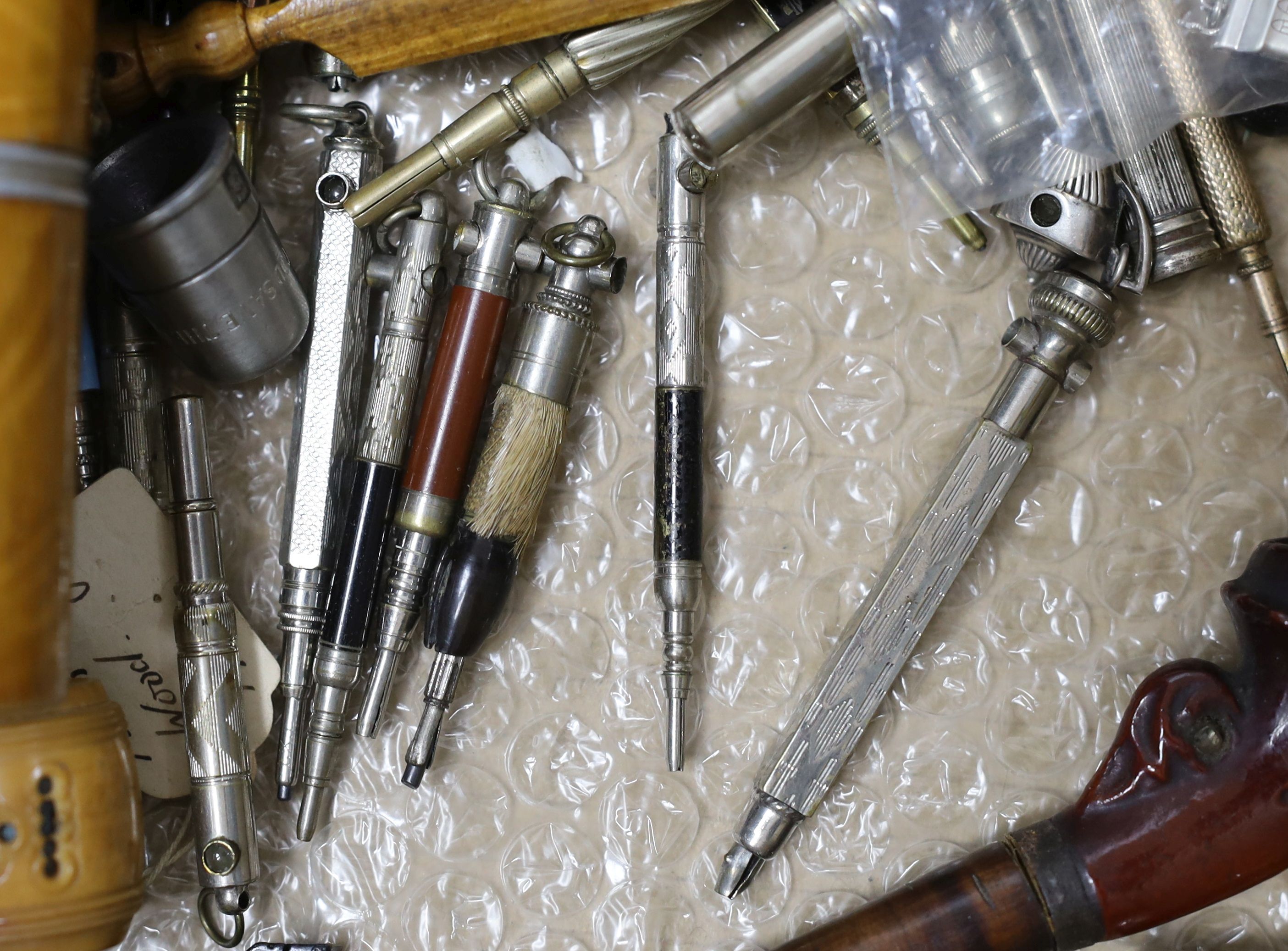 A selection of various Stanhope curios, to include treen items, charms, propelling pencils etc.